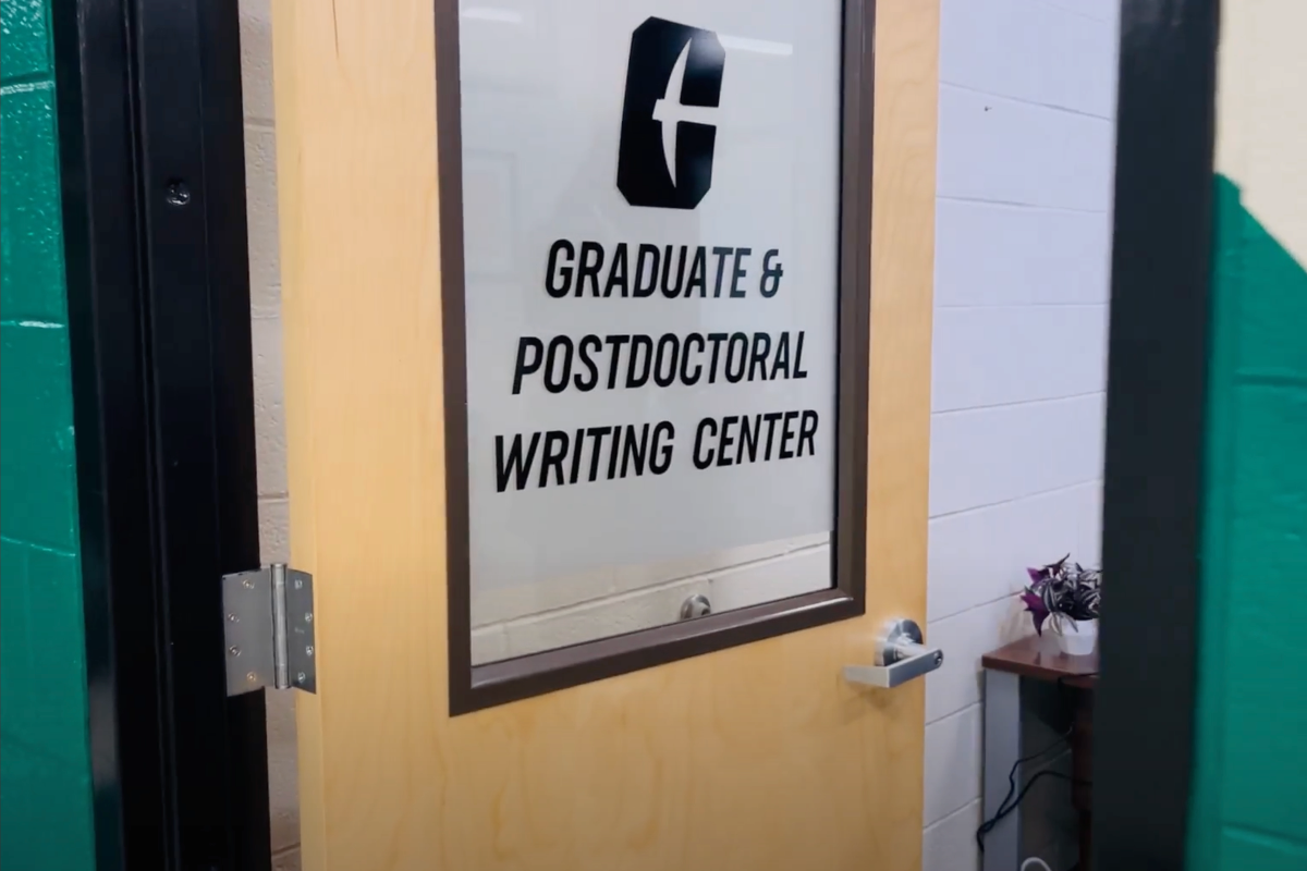 Graduate & Postdoctoral Writing Center door with Charlotte logo