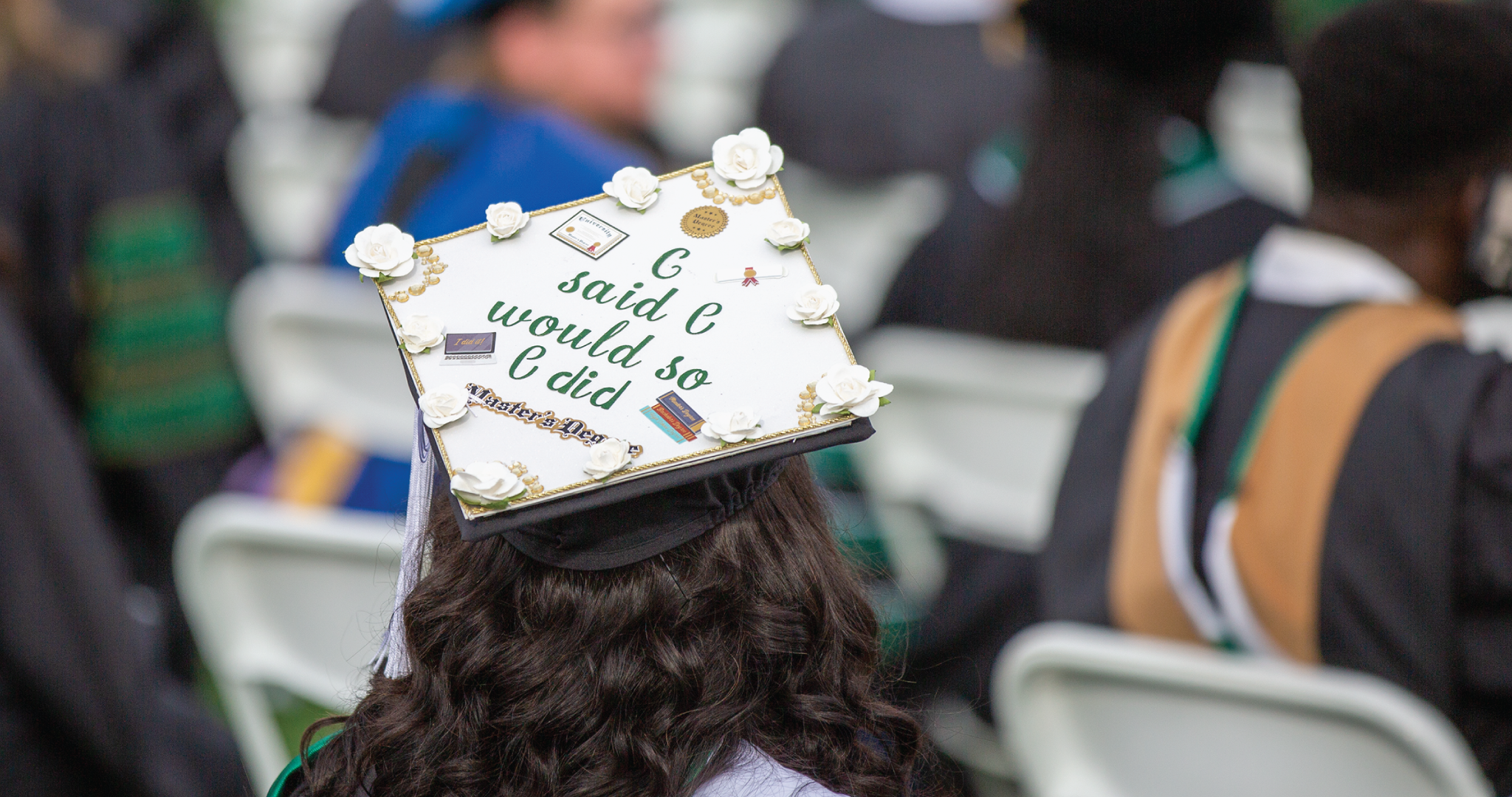 Student with graduation cap that reads "I said I would so I did"