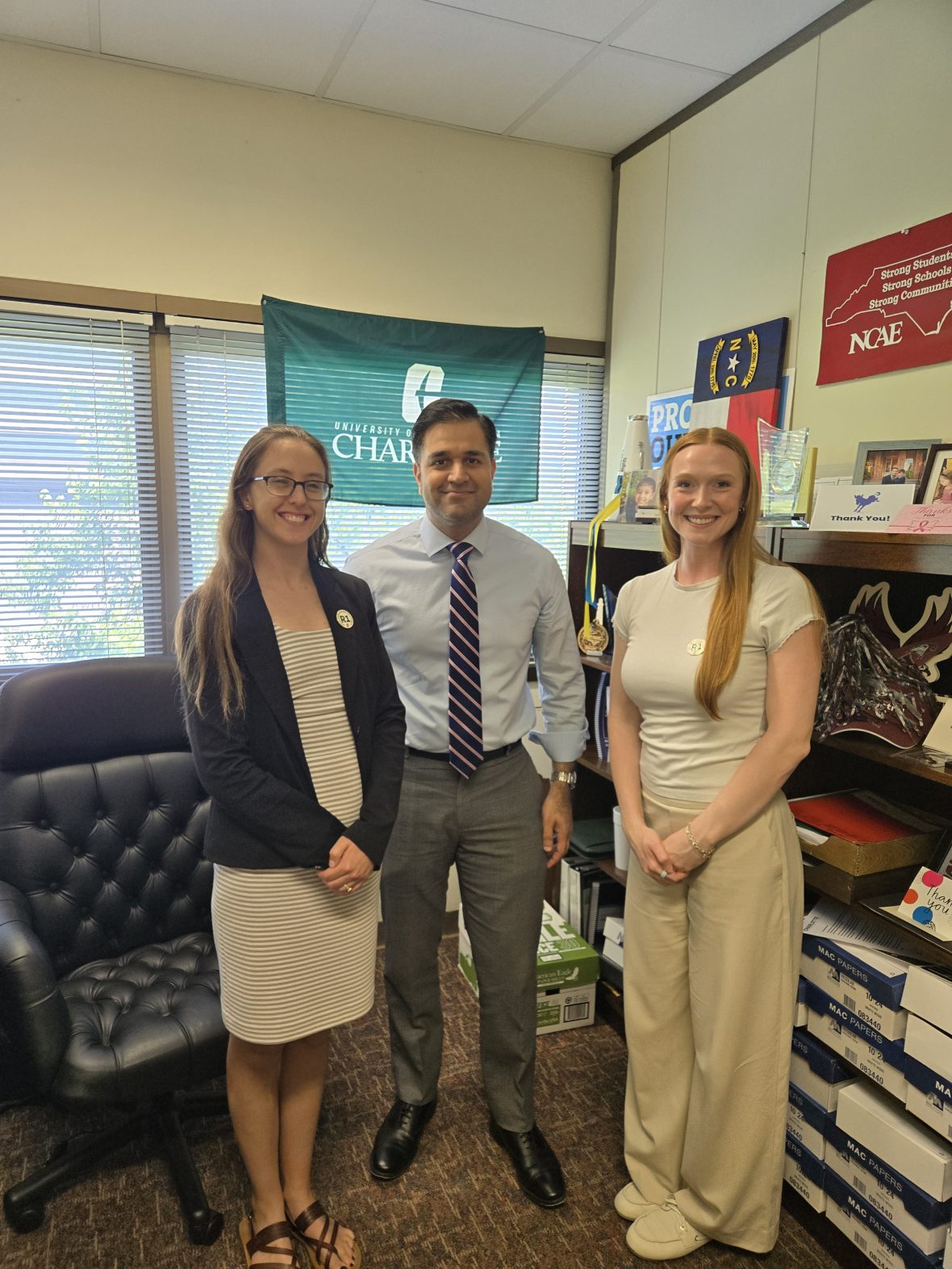 Graduate Students West and Lenz with Senator Mohammed